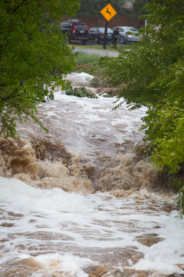 The river flowing down the middle of Table Mesa Drive in south Boulder,