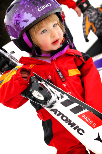 Ori holding racing skis - Age 3