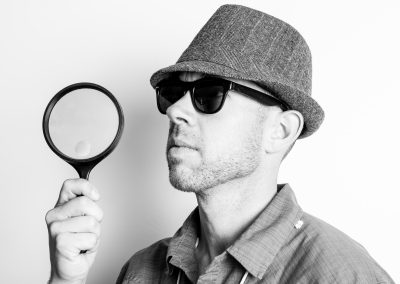 Man and magnifying glass product photo